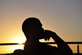 person reflecting after achieving success but feeling unfulfilled