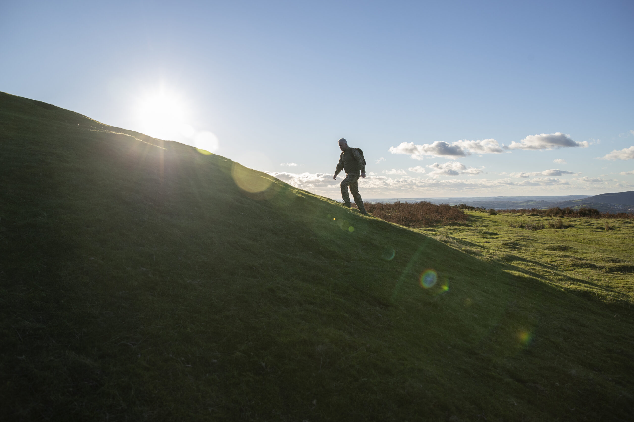A person at the very beginning of their journey to climb a mountain. This is basecamp