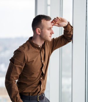 Successful professional reflecting on why success feels empty
